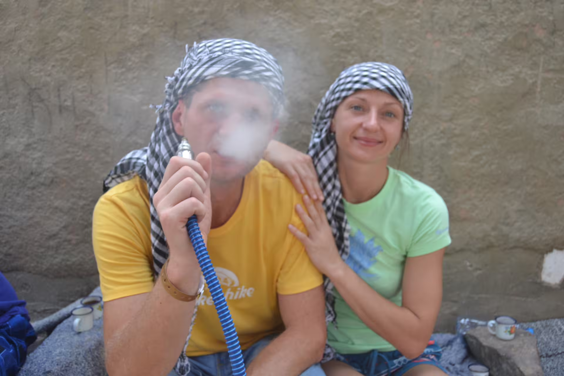 Tourists in Bedouin camp in Hurghada enjoying shisha during Mega Safari desert village stop