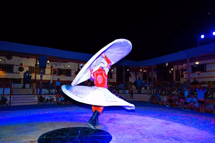 Tanoura dancer spinning at Hurghada desert safari dinner show after ATV quad and Jeep ride experience