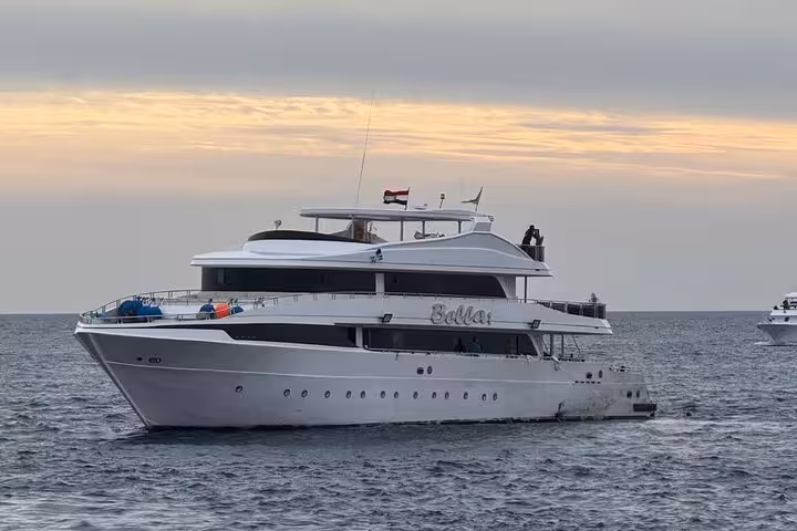 Spacious Hurghada dive boat cruising the Red Sea at sunset for a scuba sea trip with lunch and hotel transfer