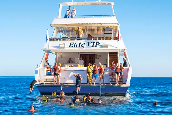 Elite VIP yacht in Hurghada with guests snorkeling in the Red Sea on a luxury cruise with buffet lunch