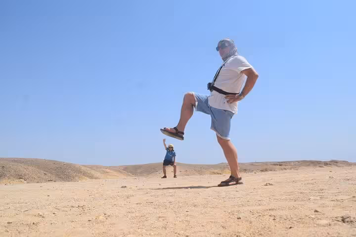 Tourists posing in Hurghada desert during family safari, 1-hour quad and buggy adventure with dinner show