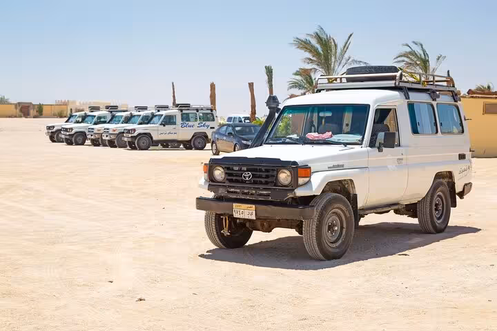 4x4 jeeps lined up for Hurghada 6-hour desert safari tour with off-road adventure, BBQ dinner and evening show