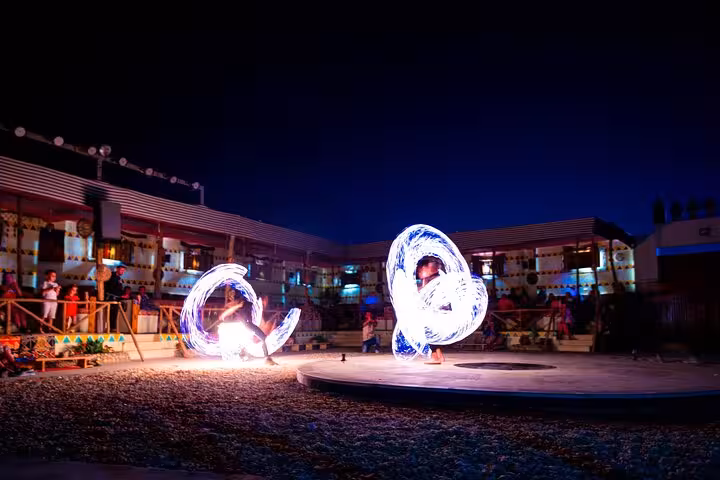 Fire show at Bedouin village dinner in Hurghada desert safari camp, part of Jeep Super Safari tour