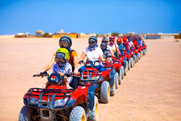 Group ATV quad biking in Hurghada desert as part of Jeep Super Safari to Bedouin village with dinner show