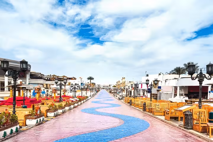Hurghada marina promenade on a city guided tour, with cafes, lanterns, and scenic walkway views