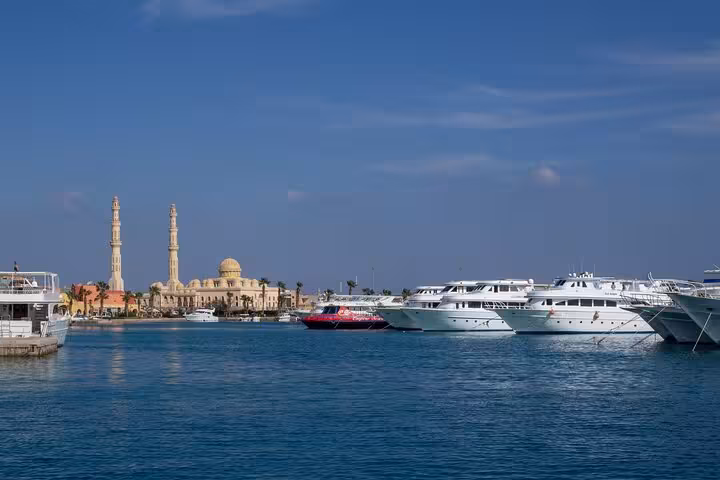 Hurghada marina skyline with mosque minarets and luxury yachts, highlight of city guided tour in Egypt
