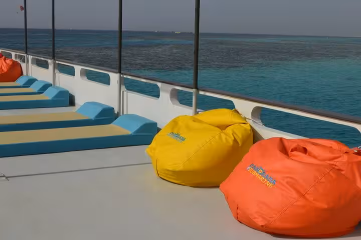 Sun deck seating and bean bags on Hurghada panorama semi-submarine, cruising Red Sea reefs before snorkeling