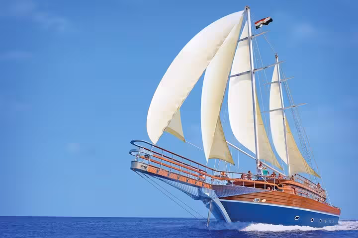 Hurghada pirate-style sailing boat cruising the Red Sea to Orange Bay with white sails on a sunny day