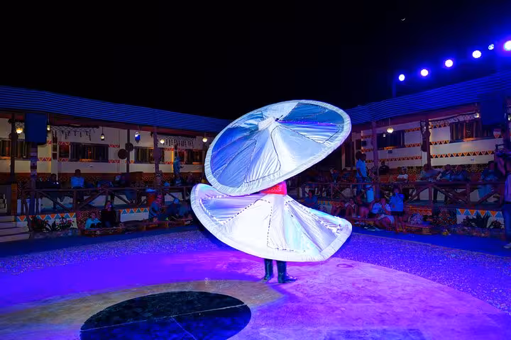 Tanoura spinning dance show at Bedouin camp dinner after Hurghada quad and Jeep family safari desert tour