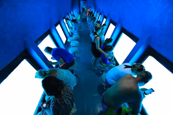 Inside Hurghada semi-submersible cabin with large underwater windows for Red Sea coral reef and fish viewing