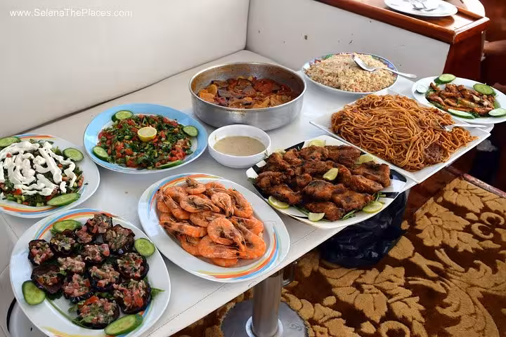 Seafood and Egyptian lunch spread on Hurghada snorkeling cruise, Red Sea day trip from Luxor with buffet