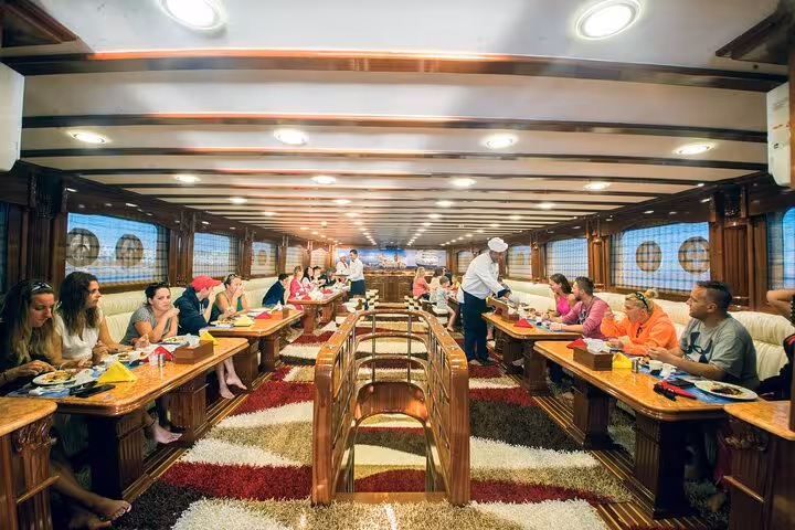 Luxury Hurghada VIP yacht dining room serving seafood and BBQ buffet lunch during Red Sea cruise