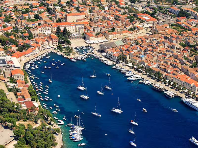 Aerial view of Hvar Town marina and Adriatic bay with yachts, popular stop on Vis and Blue Cave boat tour