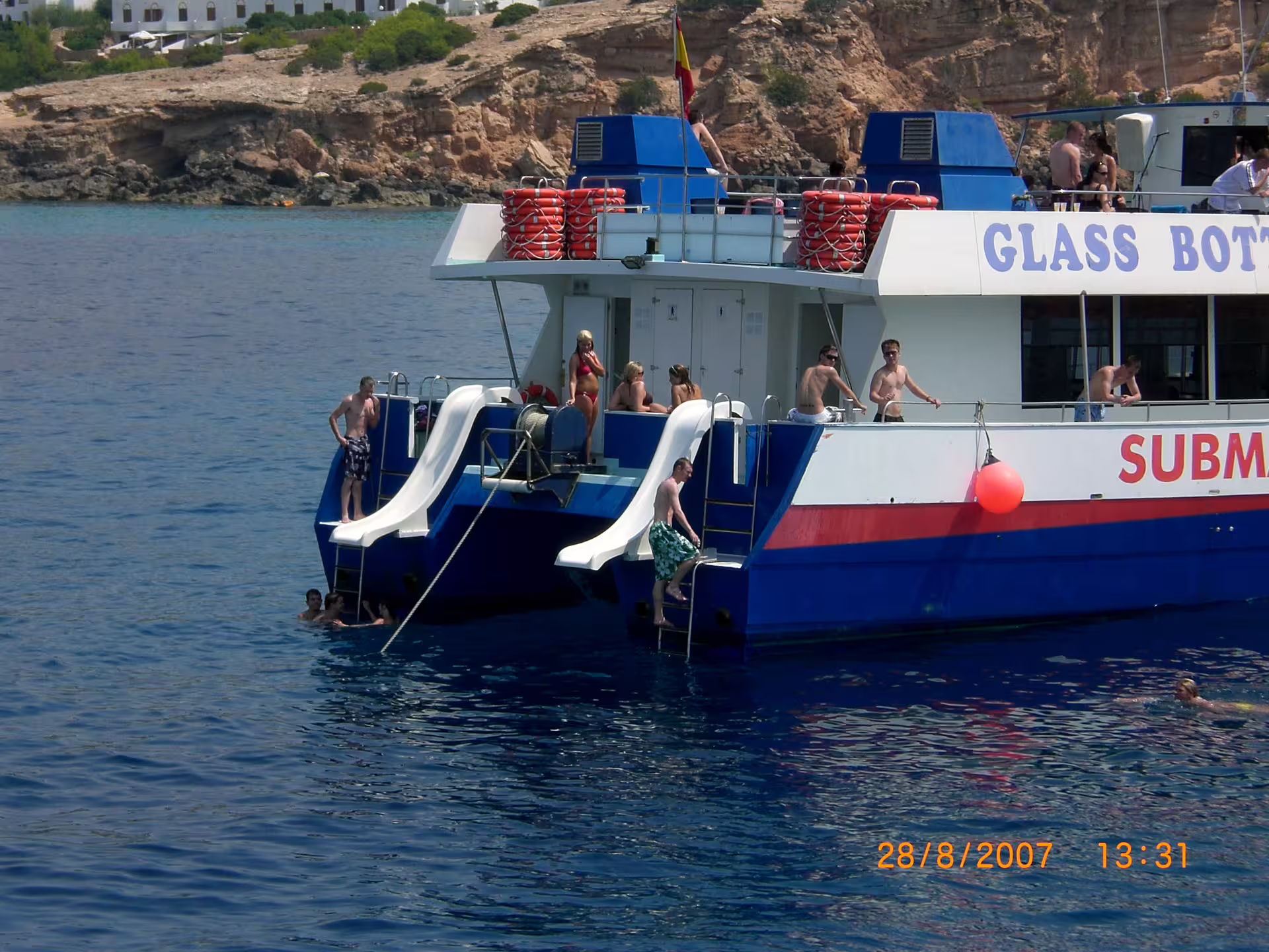 Boat stop for swimming on Ibiza sea excursion from San Antonio to Es Vedrà, with guide, aperitif and drinks included