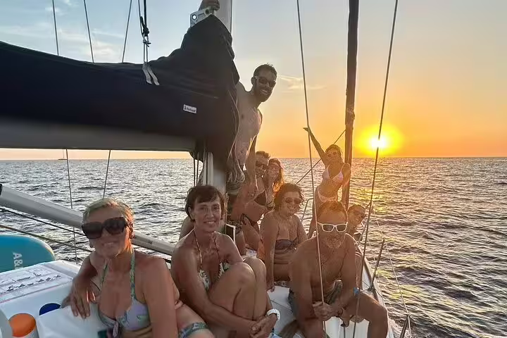 Group enjoying a sunset sailing adventure off the coast of Ibiza and Formentera, capturing the essence of Mediterranean exploration.