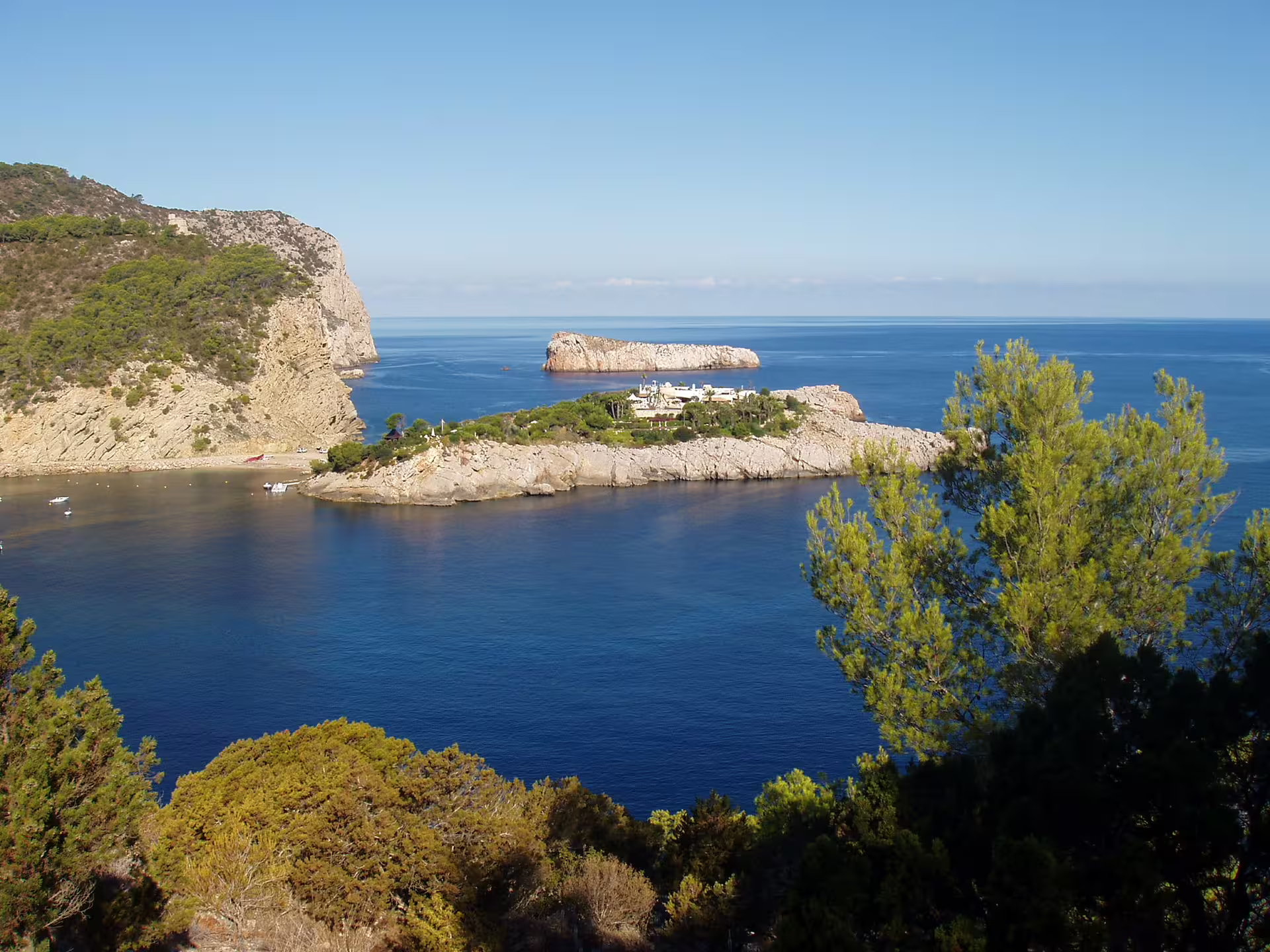 Coastal view over Puerto de San Miguel bay near Can Marçá Cave, Ibiza, before guided tour with entry tickets
