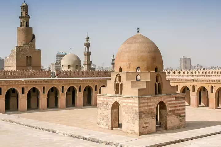 Courtyard domes and minaret at Ibn Tulun Mosque in Cairo, cultural stop on 6-day Egypt tours package