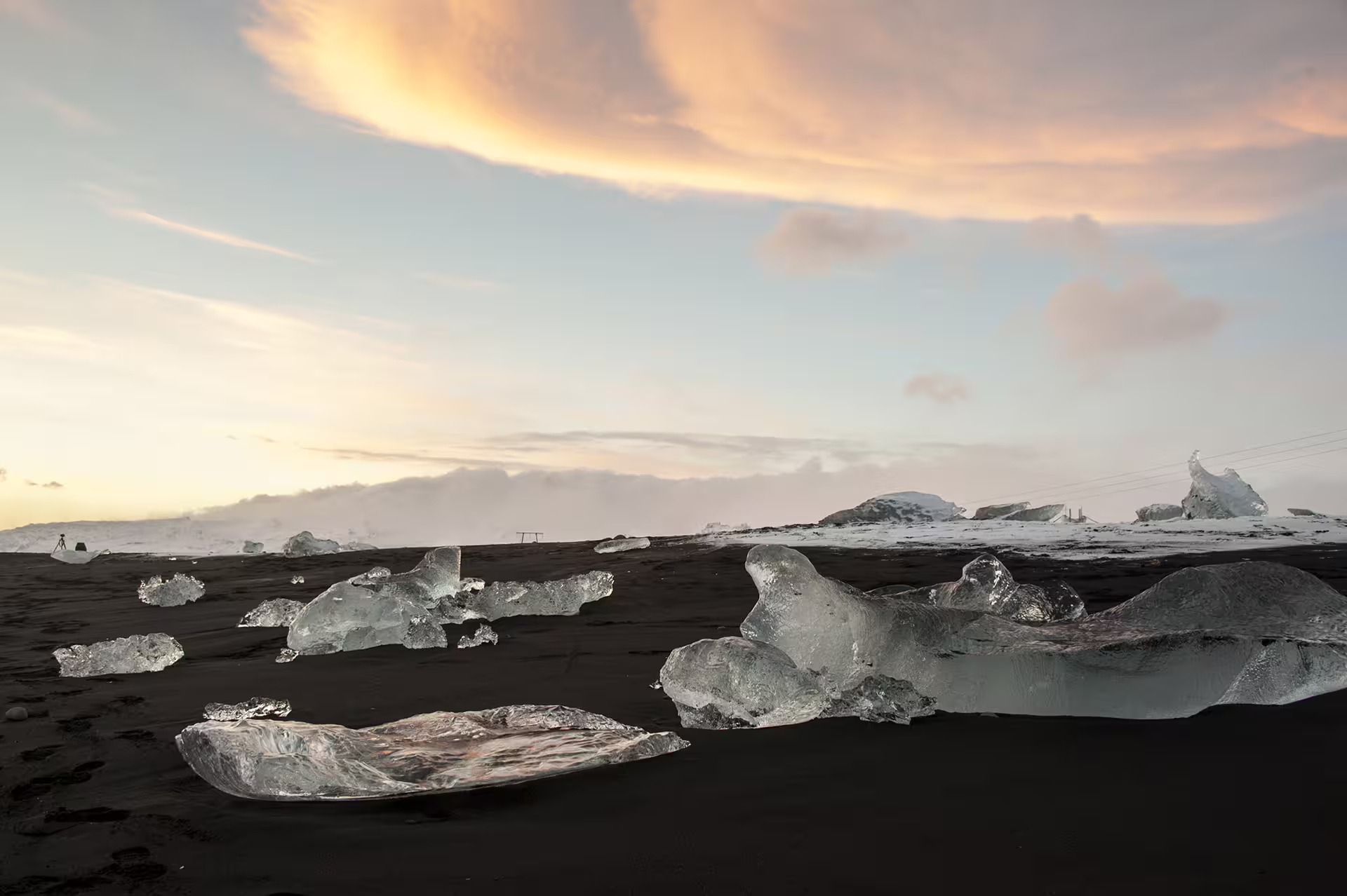 Pieces of ice on black sand near Glacier Lagoon Iceland