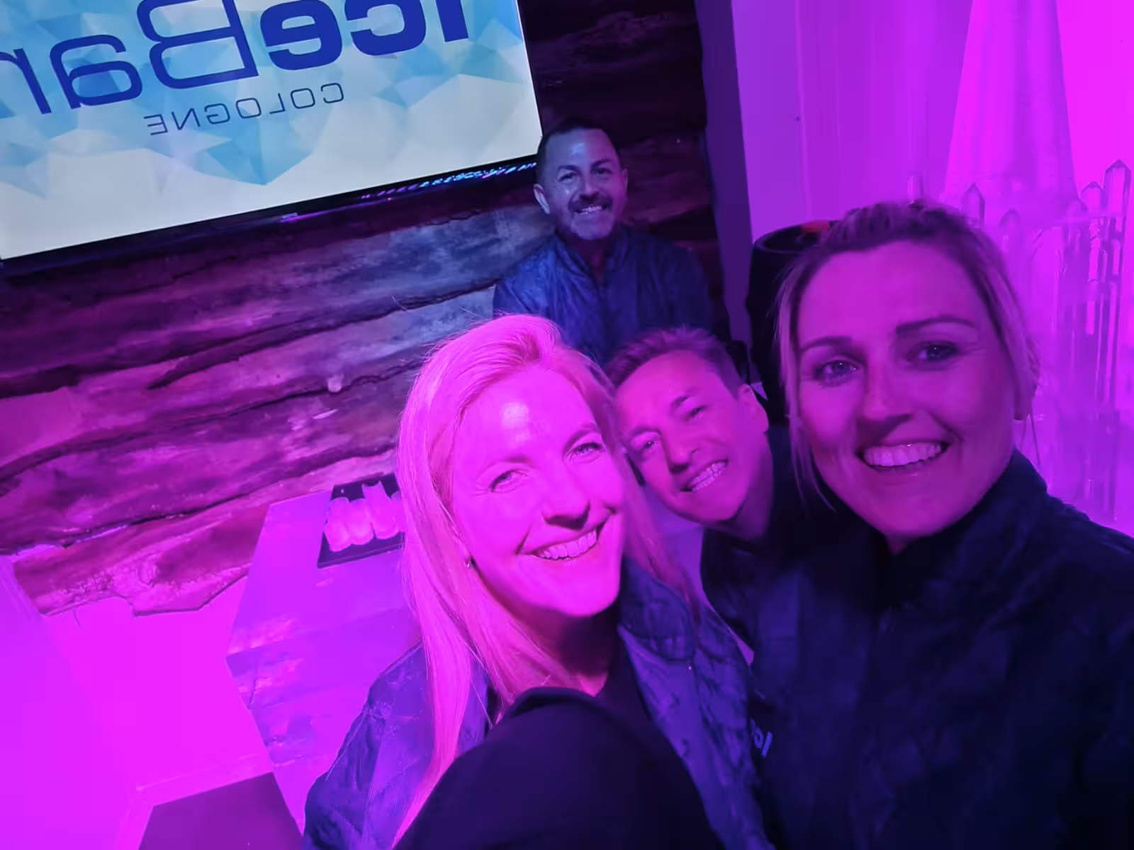 Guests enjoying their visit at IceBar Cologne, capturing smiles and memories in the vibrant, ice-themed setting.