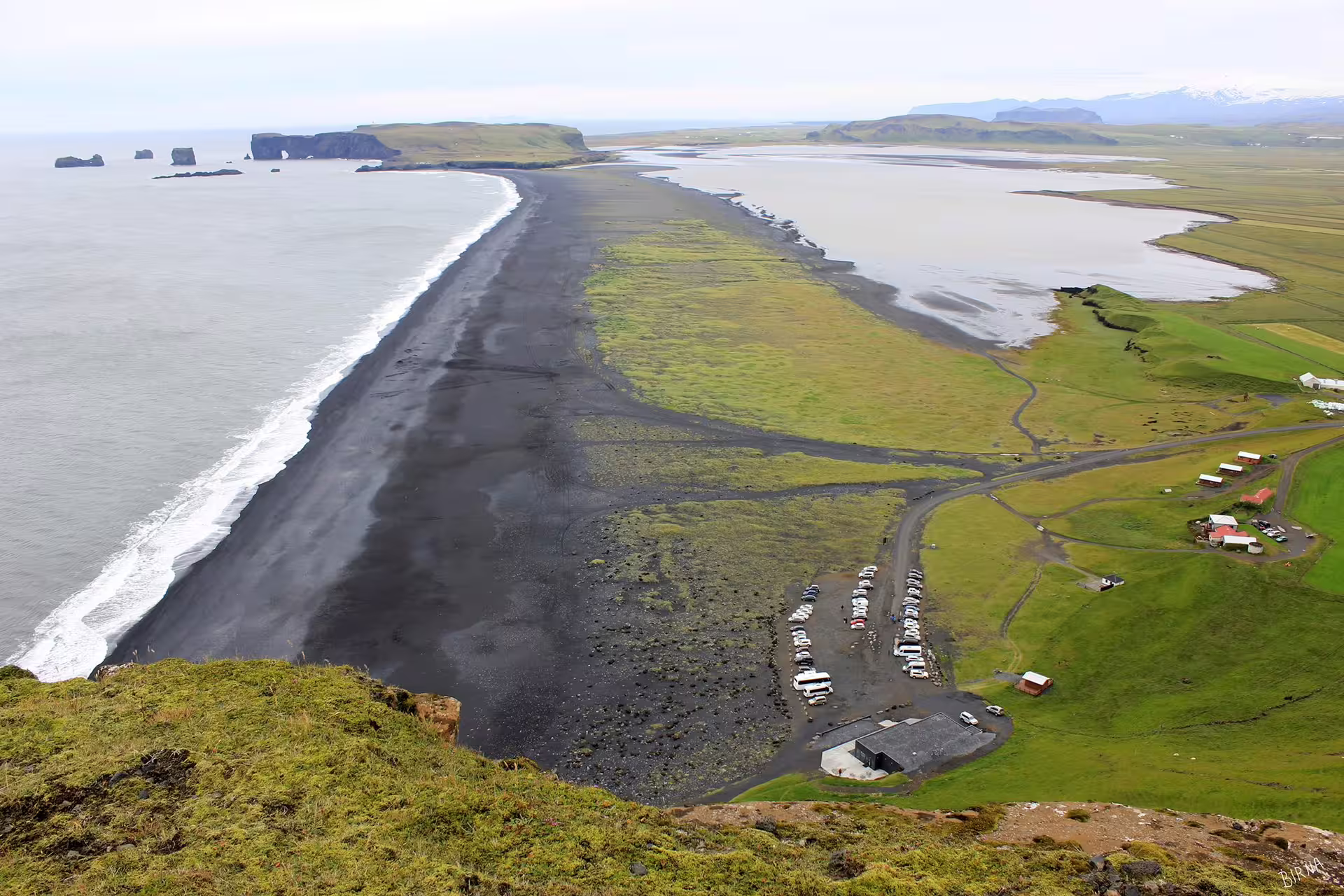 Aerial view of Iceland black sand beach coastline with sea stacks on a private full-day SUV tour