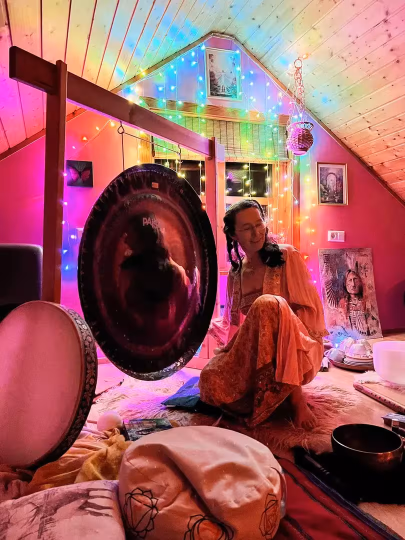 Relaxing gong bath and drum circle under festive Christmas lights, Sacred Iceland cacao ceremony experience