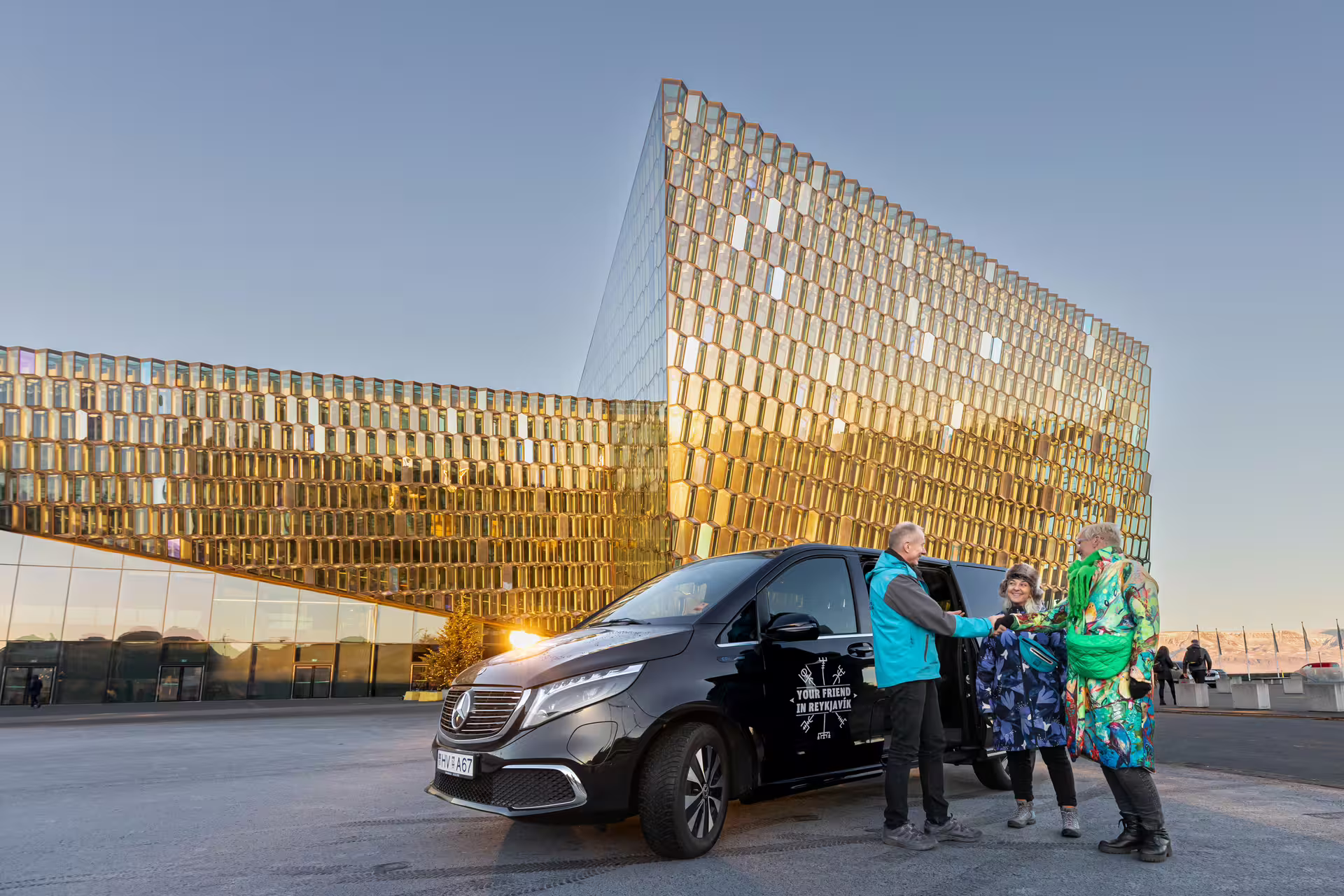 A group of travellers about to enter a Tour Vehicle from Your Friend in Reykjavik