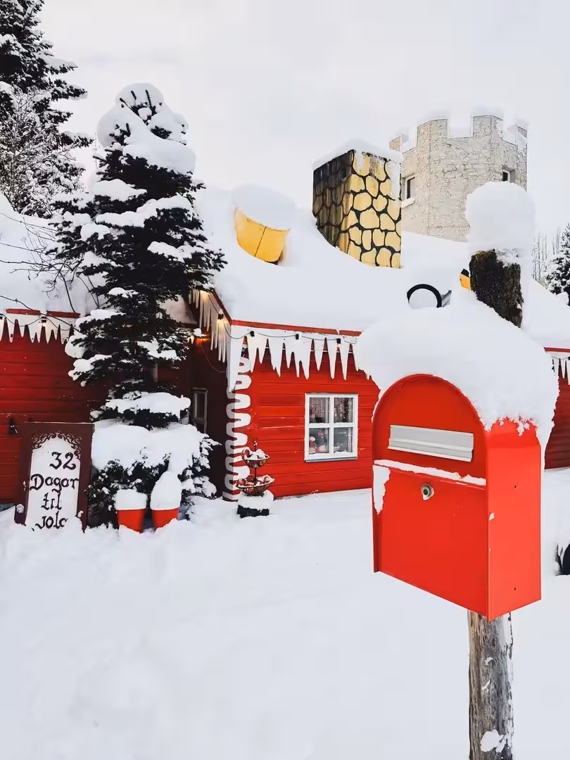 Red snowy mailbox at 32 Dagar til Jól, magical Christmas Dreams scene on Sacred Iceland Goðafoss tour