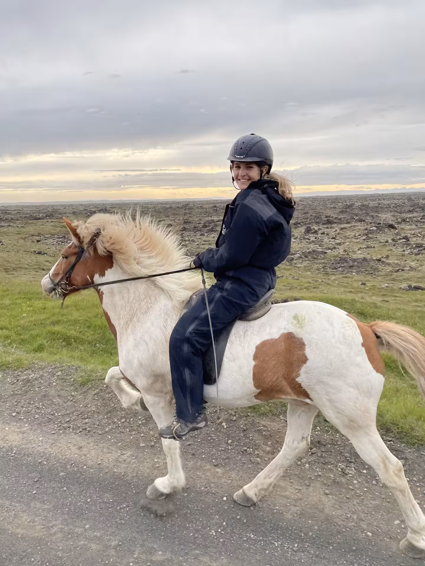 Rider on an Icelandic horse on a countryside trail, enjoying a 1 hour Iceland horse riding tour