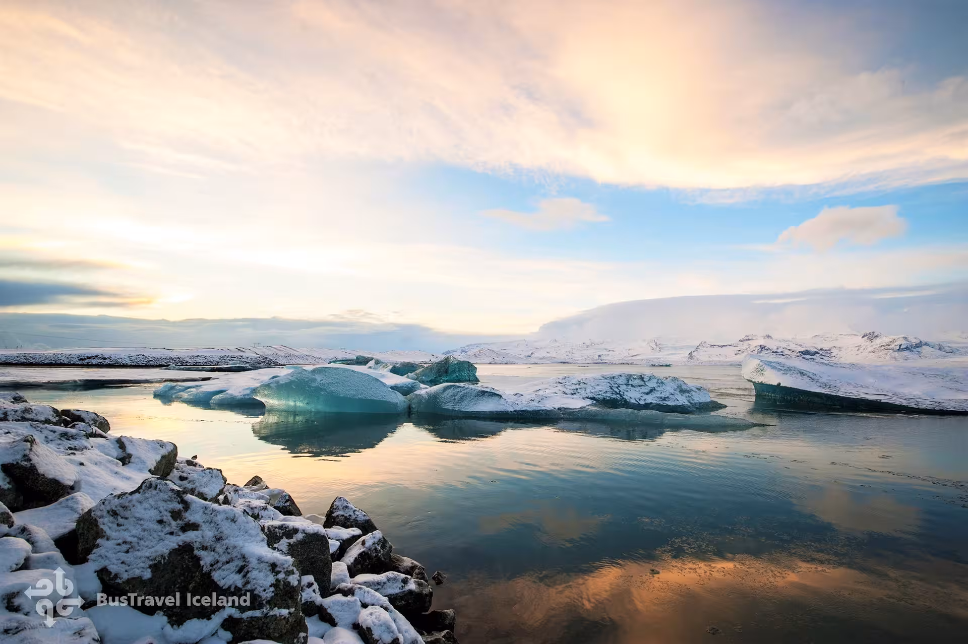 Turquoise icebergs floating on Jökulsárlón glacier lagoon at sunset in winter, Iceland