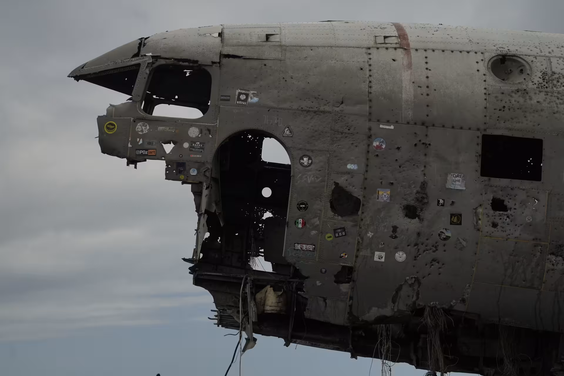 Abandoned DC-3 plane wreck on Iceland's South Coast covered in stickers and bullet holes