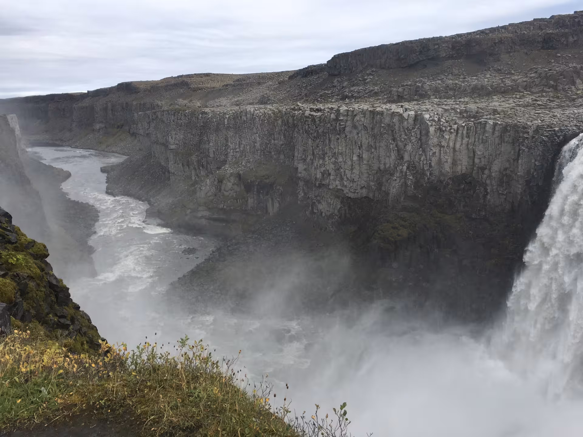 Dramatic cliffside waterfall cascading into a rugged canyon, perfect for an adventurous private Iceland tour.