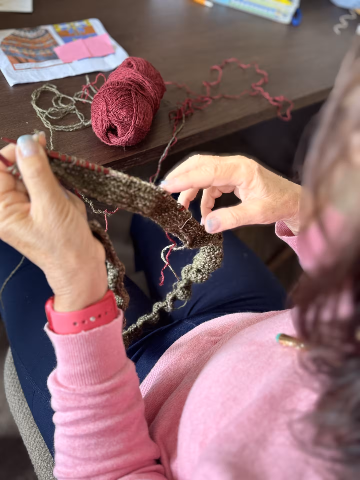 Hands knitting with Icelandic wool, showcasing traditional techniques on the Iceland Winter Knitting Tour.