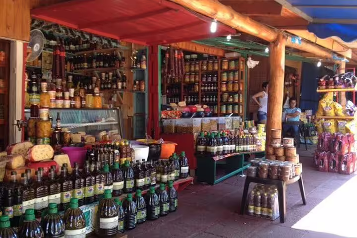 Local market brimming with colorful goods, offering an authentic taste of Iguazu Falls culture on the guided tour.