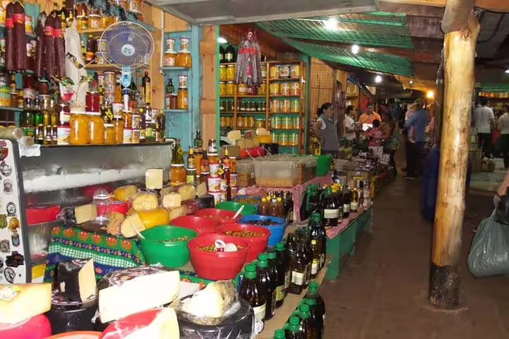 Discover the bustling market scene with local products during your 4-Day Shared Guided Tour of Iguazu Falls.