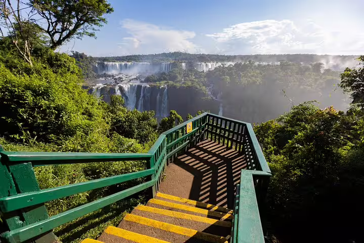 Staircase leading to a panoramic view of Iguazu Falls, highlighting the natural beauty on the guided tour.
