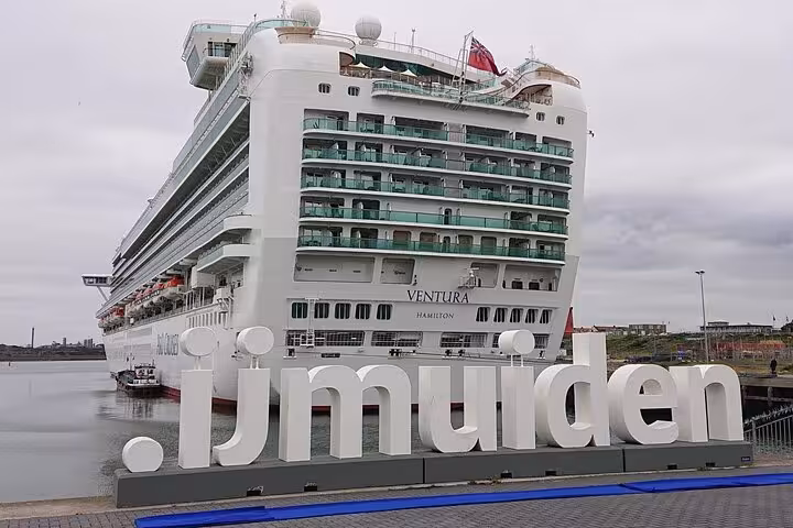 Cruise ship at IJmuiden with .ijmuiden sign, convenient private transfer from cruise port to Amsterdam city