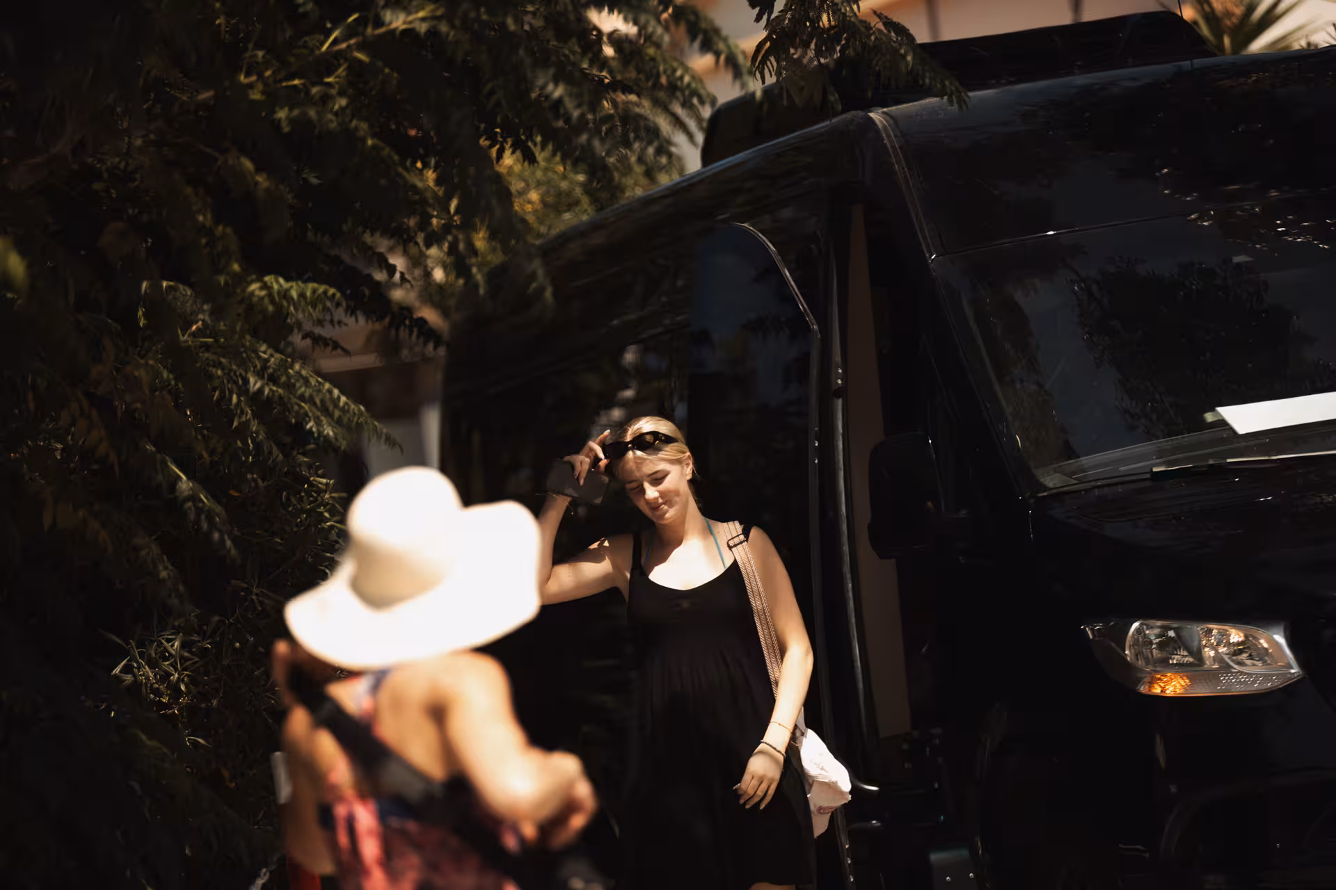 Guests stepping off a comfortable minibus to begin Ikaria highlights tour of mountain villages, Therma hot springs and lunch