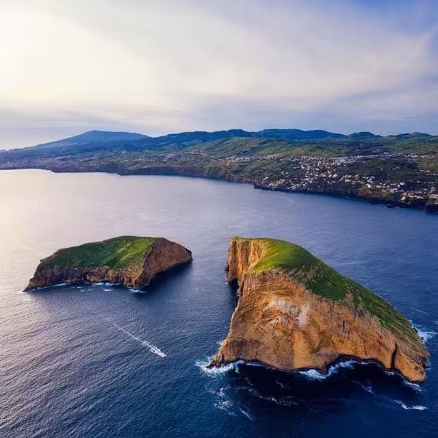 Aerial view of Ilhéus das Cabras sea stacks off Terceira Island on a 2-hour boat tour in the Azores