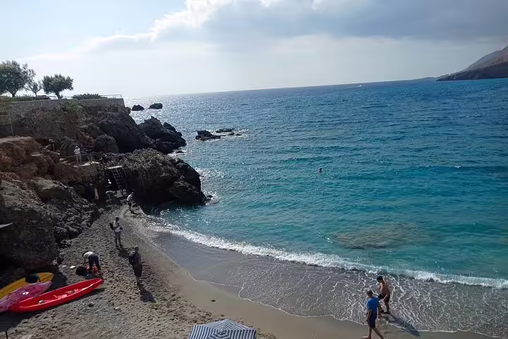 Scenic beach view with clear blue waters at Imbros Gorge, perfect for a private adventure hike and coastal exploration.