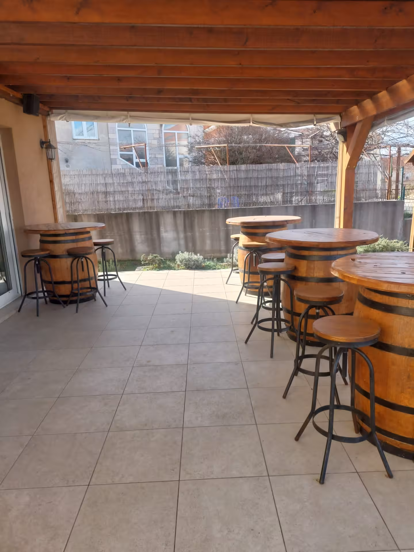 Rustic winery terrace with barrel tables, perfect stop on the Split hidden gems Imotski Lakes wine tour