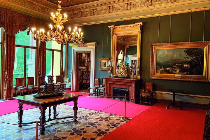 Imperial Villa Bad Ischl grand salon with chandelier and red carpet on private day tour from Salzburg