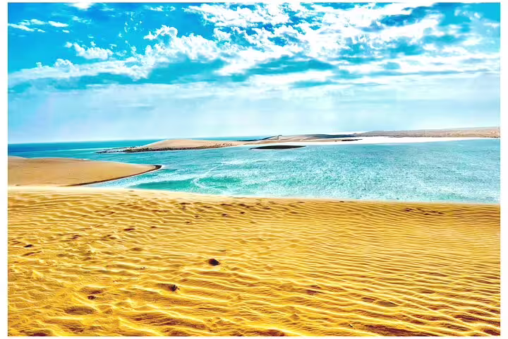 Scenic view of the turquoise waters meeting the golden desert sands at the picturesque Inland Sea.