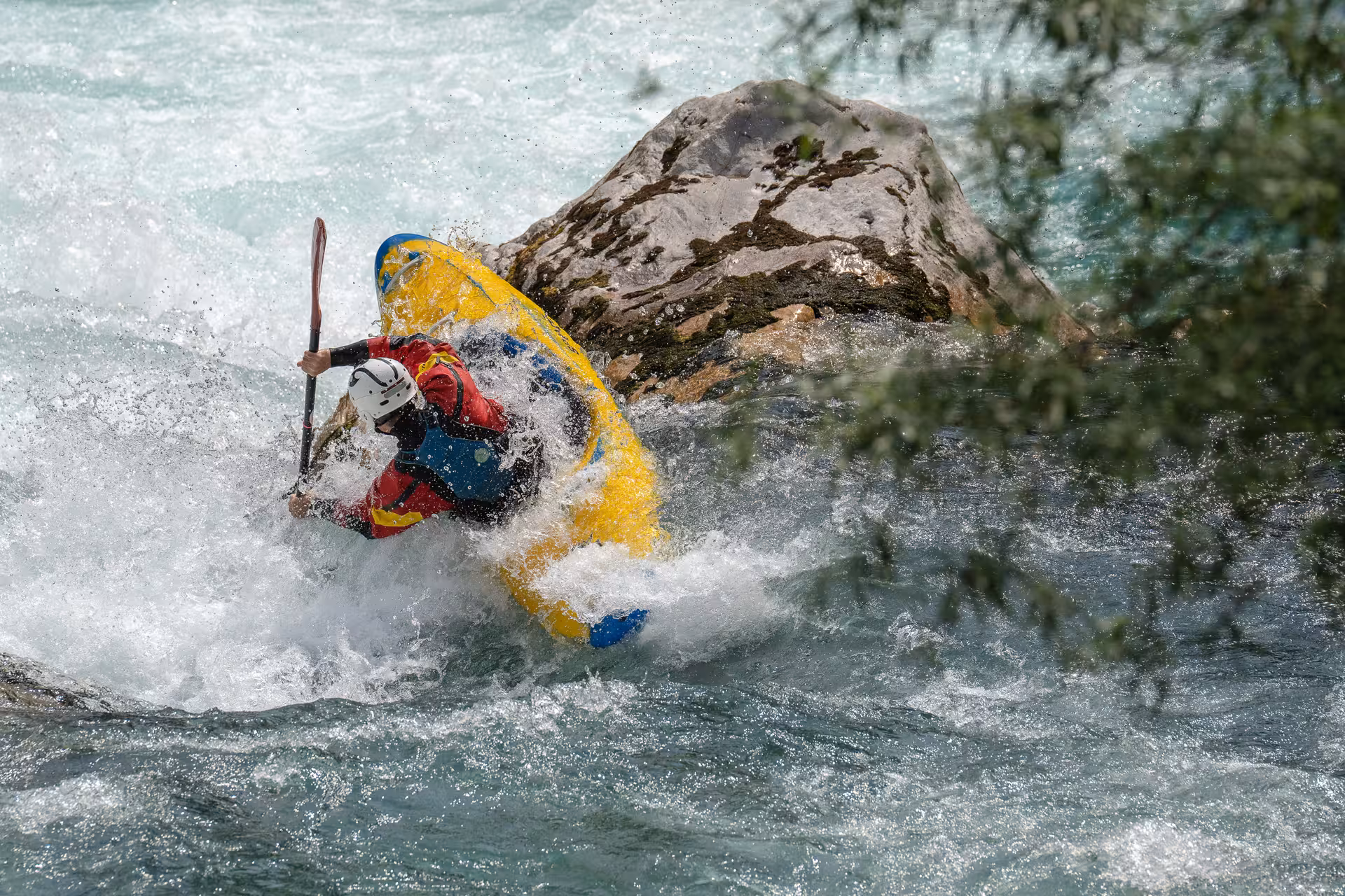 Kayaker skillfully navigating challenging rapids on an exhilarating whitewater rafting excursion in Interlaken.