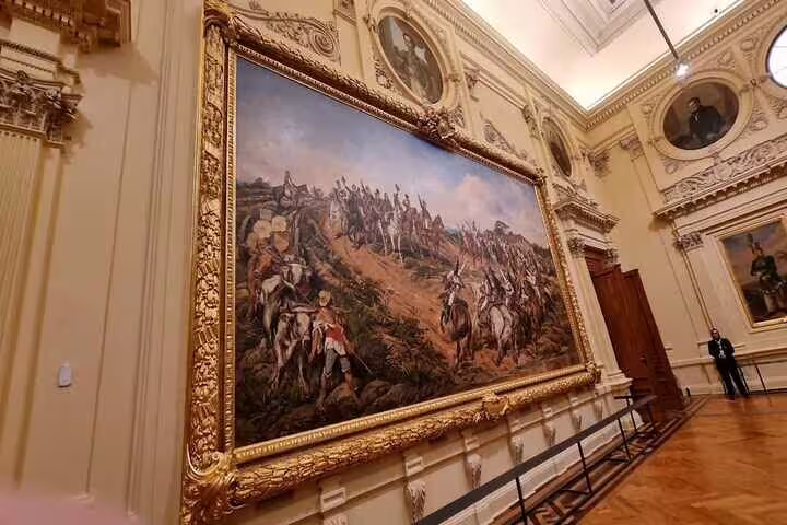 Close-up of a historic battle painting in the ornate gallery of Ipiranga Museum, Sao Paulo.