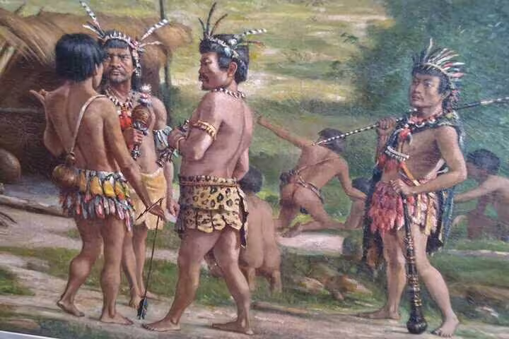 Close-up of indigenous figures in traditional attire from a historic painting at the Ipiranga Museum, Brazil.