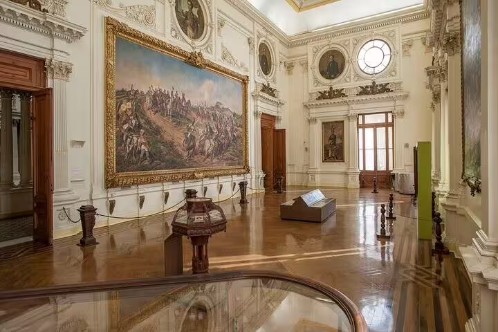 Elegant interior of Ipiranga Museum featuring historical artwork and grand architectural details.