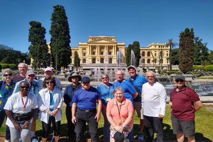 Tour group enjoying the grand architecture of Ipiranga Museum, a key site in Brazil's independence story.