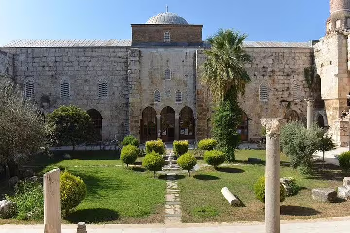 Explore the ancient beauty of Isa Bey Mosque with lush gardens on a private Ephesus tour from Izmir.