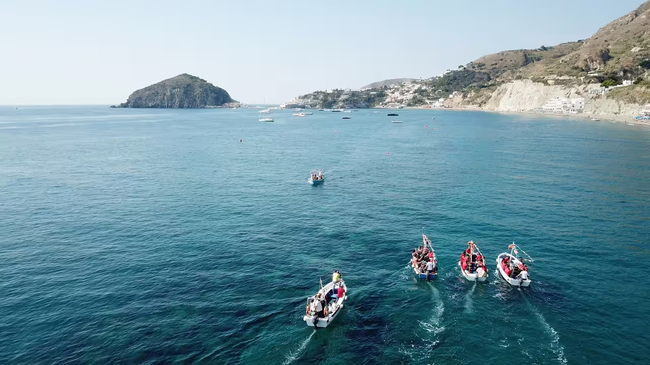 Boat tour off Ischia near Sant’Angelo and Maronti Beach, scenic coastline on day trip with Naples transfers
