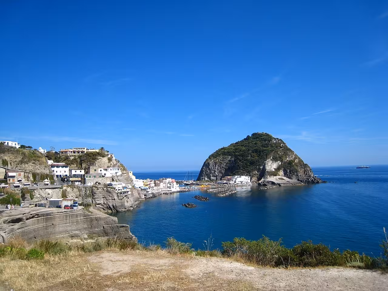 Panoramic view of Sant’Angelo bay and cliffs on Ischia, scenic viewpoint on the island bus tour